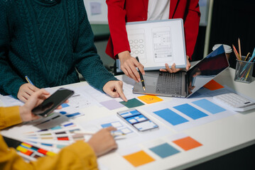  UX developer and ui designer brainstorming about mobile app interface wireframe design with...