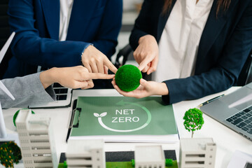 Business people having consultation about wind energy at company office. Business team discussing about windmill and alternative green energy.