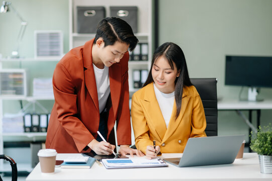 Asian female marketing manager with Kind leader executive manager share and discuss business solutions plan ideas