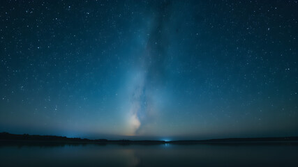Serene Night Sky Over Calm Waters