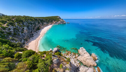 Aerial view of vibrant turquoise waters nestled between steep rocky cliffs, greenery and sandy beach