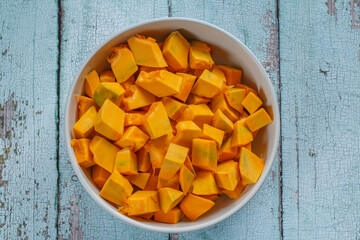 Pumpkin pieces in a bowl.