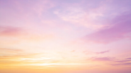 Fototapeta premium Sunset sky with soft clouds, orange and purple tones blending smoothly, tranquil and inviting atmosphere.