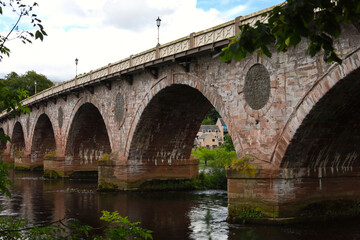 Fototapeta premium View of an old historic bridge over a river in Scotland, UK