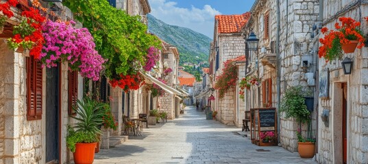 Fototapeta premium Picturesque Cobblestone Street Adorned with Vibrant Flowers in a Charming European Town