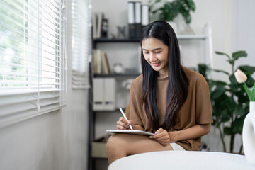 Young Woman Using Digital Tablet in Modern Home Office Setting, Embracing Technology Lifestyle for Work and Leisure