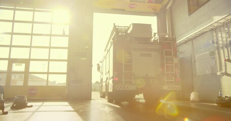 Fire Truck Exits the Fire Department, Highlighting the Urgency and Readiness of Firefighters Responding to an Emergency Call. Team Drive Off to Handle a Critical Situation. Warm Color Grade
