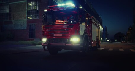 Emergency Lights Illuminate the Night as a Fire Truck Rolls Down a Street, Rushing to Assist in an Emergency. Truck with Firefighters Cuts Through the Night Traffic with Urgency. Car to Car Footage