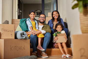Happy multiethnic family smiling after moving home