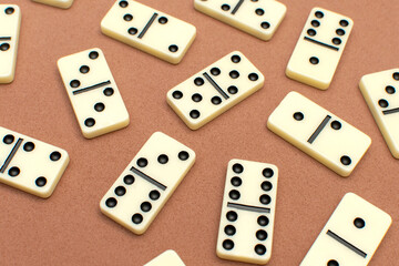 Dominoes bones on brown background	