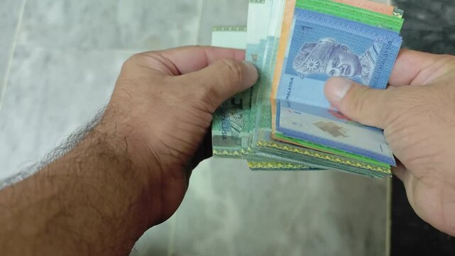 Counting Cash Malaysian Ringgit