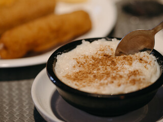 A dessert of a restaurant in a black bowl