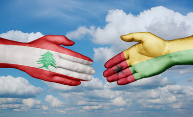 Guinea-Bissau and Lebanon country handshaking with flags, consensus concept international co-operation illustration