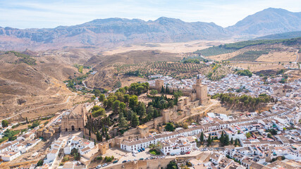 Fototapeta premium Aerial photo from drone to along the old town of Antequera, Spain overlooking the big fortress.Antequera, Andalusia, Spain