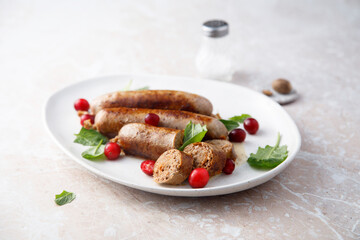 Homemade sausages with spinach and cranberry