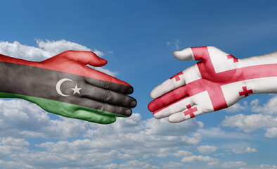 Georgia and Libya country handshaking with flags, consensus concept international co-operation illustration