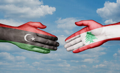Lebanon and Libya country handshaking with flags, consensus concept international co-operation illustration