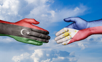 Philippines and Libya country handshaking with flags, consensus concept international co-operation illustration