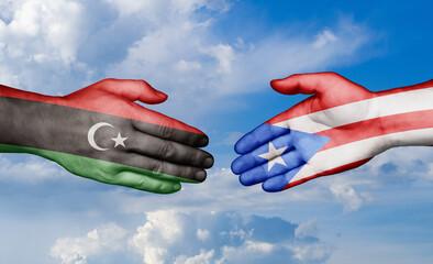 Puerto Rico and Libya country handshaking with flags, consensus concept international co-operation illustration