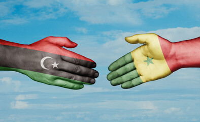 Republic of Senegal and Libya country handshaking with flags, consensus concept international co-operation illustration