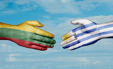 Uruguay and Lithuania country handshaking with flags, consensus concept international co-operation illustration