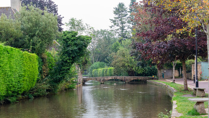 Bourton-on-the-Water is only 4 miles from
Stow-on-the-Wold and straddles the river Windrush with its series of elegant low bridges beside neat tree-shaded greens and tidy stone banks.