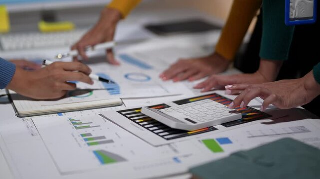 Business team analyzing financial data and brainstorming