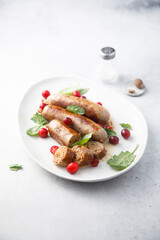 Homemade sausages with spinach and cranberry