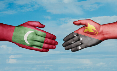 Papua New Guinea and Maldives country handshaking with flags, consensus concept international co-operation illustration