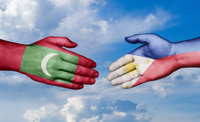 Philippines and Maldives country handshaking with flags, consensus concept international co-operation illustration