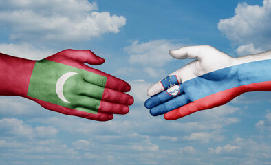 Slovenia and Maldives country handshaking with flags, consensus concept international co-operation illustration
