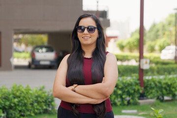 Indian Woman with Sunglasses and looking  at the camera