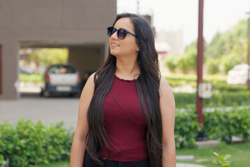 Indian Woman with Sunglasses Looking Around