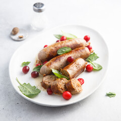 Homemade sausages with spinach and cranberry