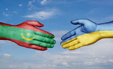 Ukraine and Mauritania country handshaking with flags, consensus concept international co-operation illustration