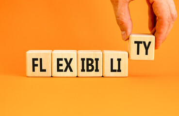 Flexibility symbol. Concept word Flexibility on beautiful wooden blocks. Beautiful orange...