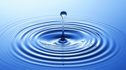 A drop of water is falling into a large blue wave