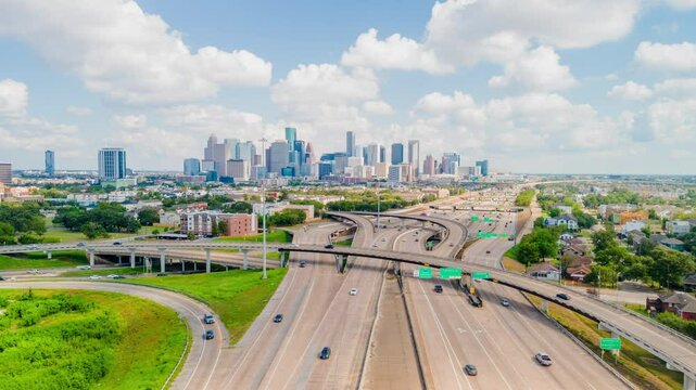 Downtown Houston Drone hyper-lapse on Sunny day. Timelapse traffic on Highway 288 overlooking downtown Houston. Traffic on freeway Texas 288 Timelapse aerial