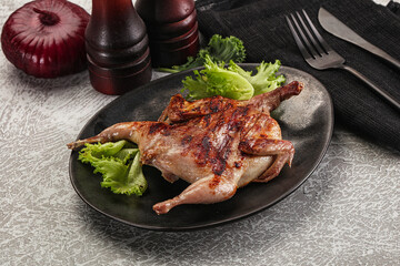 Grilled quail in the plate