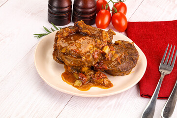 Italian cuisine - ossobuco with sauce