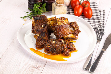 Prepared tasty beef ribs with sauce