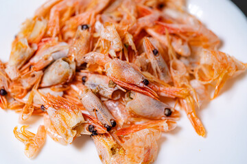 Shrimp dinner on a white plate.