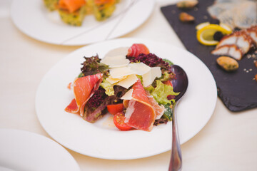 Prosciutto salad on the dining table.