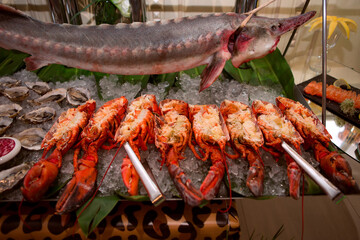 Fresh seafood display with lobster and sturgeon.