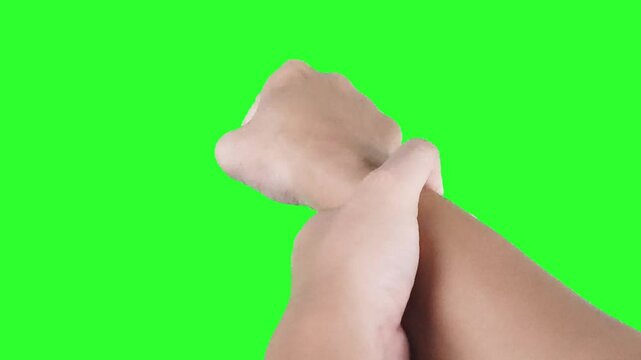 Warm up by rotating your wrists against a green screen background. Get ready to fight