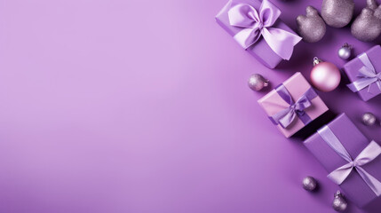 Fototapeta premium Top view of gifts, bows and Christmas decorations on a violet background