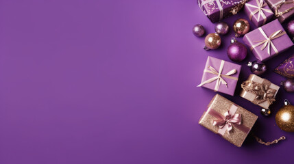 Top view of gifts, bows and Christmas decorations on a violet background