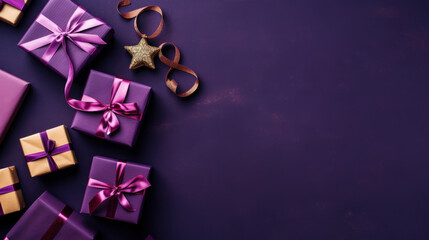 Top view of gifts, bows and Christmas decorations on a dark purple background
