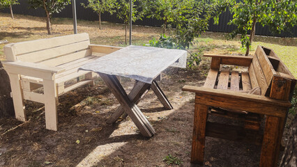 wooden benches and a table in the garden, a place to rest