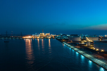 Aerial morning sun at world-class oil refinery, Petroleum refinery in the industrial factory of heavy industry zone, oil production plant, industrial process plant, oil storage tank and pipeline steel